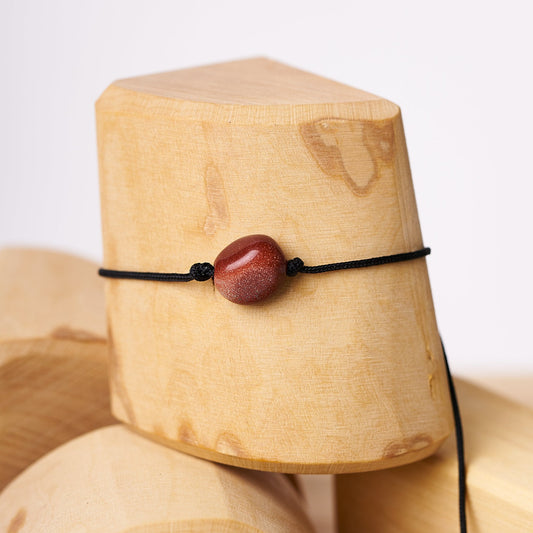 Pulsera de piedra lluvia de oro en solitario